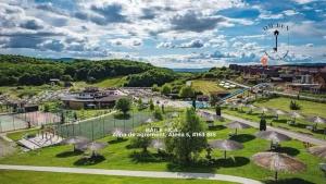 an aerial view of a park with an amusement park at Casa Om Bun in Beclean
