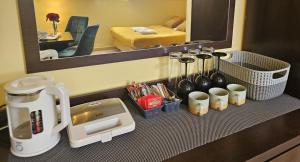 a coffee maker on a counter in a hotel room at Gościnne Zacisze in Grzybowo +80 photos