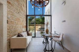 a living room with a couch and a table at Domus Sagari in Presicce