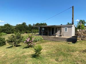 a small house in a field with a yard at CA Home in Aiguèze +13 photos