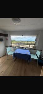 a room with a table and two chairs and a window at Chi Byghan in Gulval