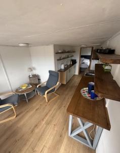 a living room with a couch and a table at Chi Byghan in Gulval