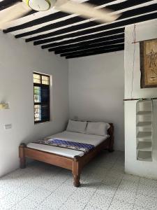 a bedroom with a bed in the corner of a room at Warembo beach Nungwi in Nungwi