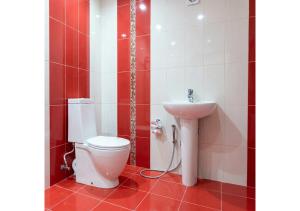 a bathroom with a toilet and a sink at Forest Edge Guesthouse in Aghavnadzor