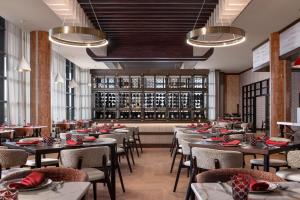 a restaurant with tables and chairs in a room at Hollywood Casino Aurora in Aurora