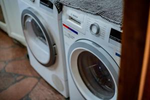 a washer and dryer sitting next to each other at Koń na biegunach in Glaznoty