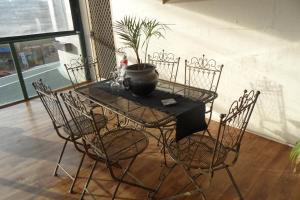 a table with chairs and a potted plant on it at 31 on the Terrace in Denmark