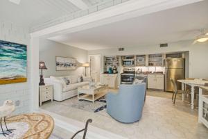 a living room with a couch and a kitchen at Seascape 3522 in Kiawah Island