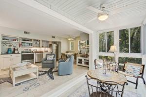 a living room with a table and chairs at Seascape 3522 in Kiawah Island