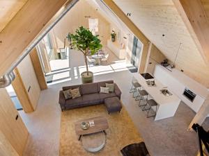 an overhead view of the living room and kitchen of a house at Villa WOOD in Elsendorp +32 photos