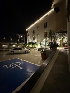 a car parked in front of a building at night at سراة للشقق الفندقية in Al Namas