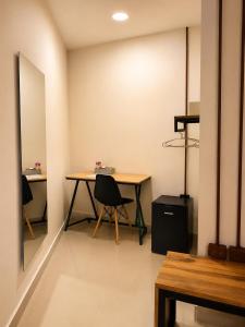 a room with a table and two chairs in it at ETHNIC Thematic Hotel in Cartagena de Indias