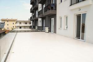 an empty balcony of a white apartment building at Corner Apartments in Tirana