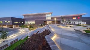 a large building with a plaza in front of it at TNC Stays Luxurious Modern Suite Seton Calgary South in Calgary