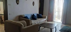 a living room with a couch and chairs and a table at Zaytouna camp Room 2 in Marsa Matruh