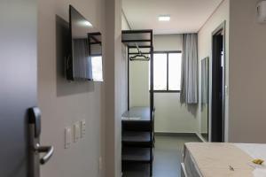 a room with a staircase leading to a bedroom at Palhoça Hotel in Canindé