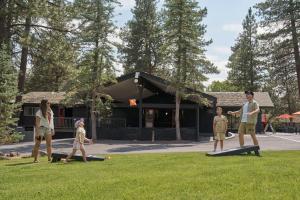 a group of people playing frisbee in the grass at Trailhead Lodge in Bend