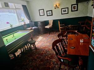 a room with a pool table in a restaurant at The Waggon & Horses in York