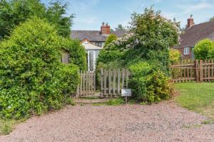 a wooden fence in front of a house at 2 Bed in Richards Castle oc-r45225 in Lane to Richards Castle +15 photos