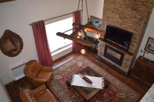 an overhead view of a living room with a fireplace at Alojamento Madeira`s in Videmonte