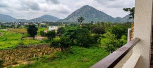 a view of the mountains from a building at SVL HomeStay in Chik Ballāpur