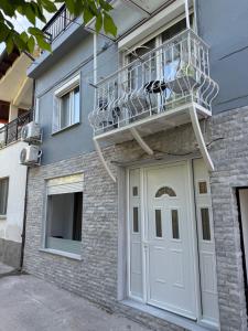 a balcony on the side of a building with a door at Marinas view apartment in Limenas