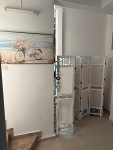a room with a painting of a bike on the wall at Marinas view apartment in Limenas