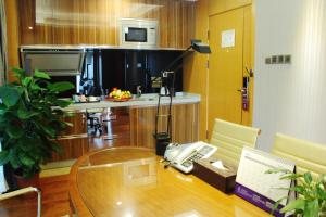 Kuchyňa alebo kuchynka v ubytovaní Sentosa Hotel Apartment Taoyuan Branch