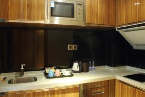 Kuchyňa alebo kuchynka v ubytovaní Sentosa Hotel Apartment Taoyuan Branch