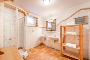 a bathroom with a sink and a shower at my Hütten Katschberg in Katschberghöhe +52 photos