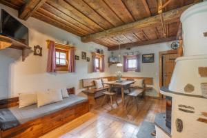a living room with a couch and a table at my Hütten Katschberg in Katschberghöhe