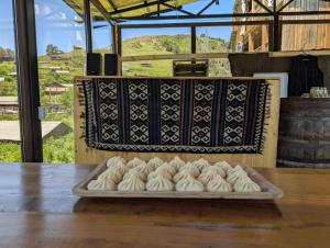 a tray of food on top of a table at Guesthouse Javakhe in Omalo