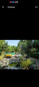 a yellow car is parked in a parking lot at Glamping Tlaconal in Oaxtepec