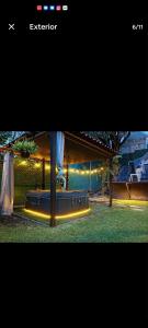 a picture of a house with a bed in the yard at Glamping Tlaconal in Oaxtepec