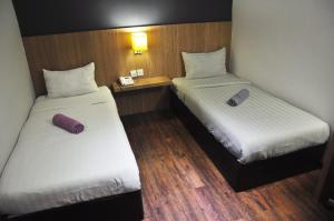Ένα ή περισσότερα κρεβάτια σε δωμάτιο στο Hotel 99 Botanik Klang