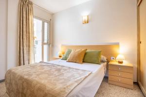 a bedroom with a large bed and a window at Home2Book Sunny Terrace Apt, el Rincón de ManFe in Candelaria