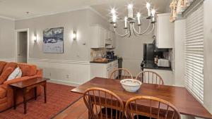 a kitchen and dining room with a table and chairs at Green Mountain Inn in Stowe