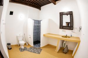 a bathroom with a sink and a toilet at Riad Al Fanouss in Fez