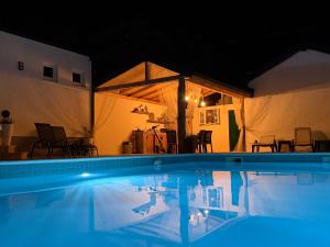 a swimming pool in a house with a tent at PIK Residence in Mostar