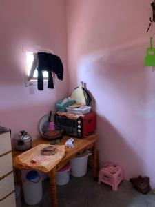 a room with a table with a radio on it at Amzdogh in Sidi Ifni