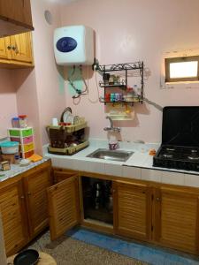 a kitchen with a sink and a counter top at Amzdogh in Sidi Ifni