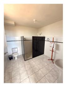 a bathroom with a toilet and a sink at Hotel Central in Recife +62 photos