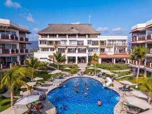 an aerial view of a resort with a swimming pool at vivo resort in Chano