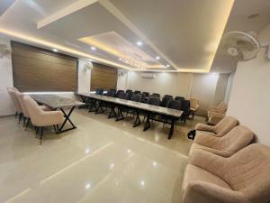 a conference room with a long table and chairs at Hotel LA Costa, A Luxury Hotel In Haridwar in Haridwār