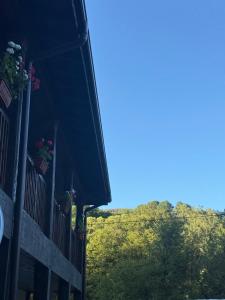 a balcony of a house with flowers on it at Белите Къщи in Seltse +13 photos