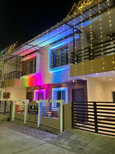 a building with colorful lights on the side of it at Ujjain Sparsh Stays in Ujjain