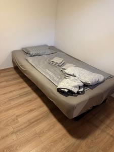 a bed with two pillows on it in a room at Palčkov oddih in Škofja Loka