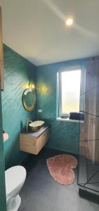 a bathroom with a sink and a toilet and a mirror at ApartHotel NoahResidence in Alba Iulia +50 photos