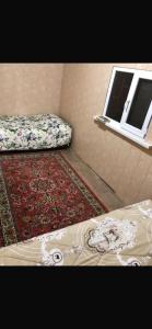 a room with two beds and a window at Saida guest house in Rybpunkt