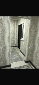 an empty room with a door and a window at Saida guest house in Rybpunkt